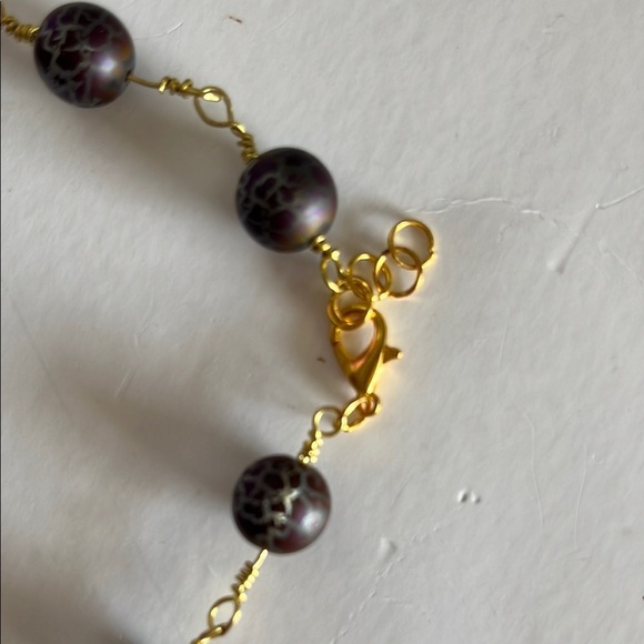 Gold and Black Bracelet with Elegant Bead Design - Picture 2 of 6